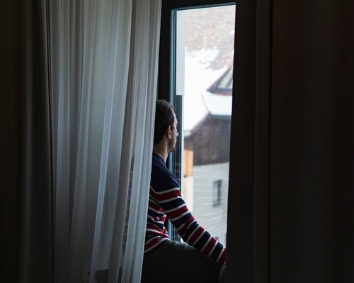 Person taking visual rest looking out window